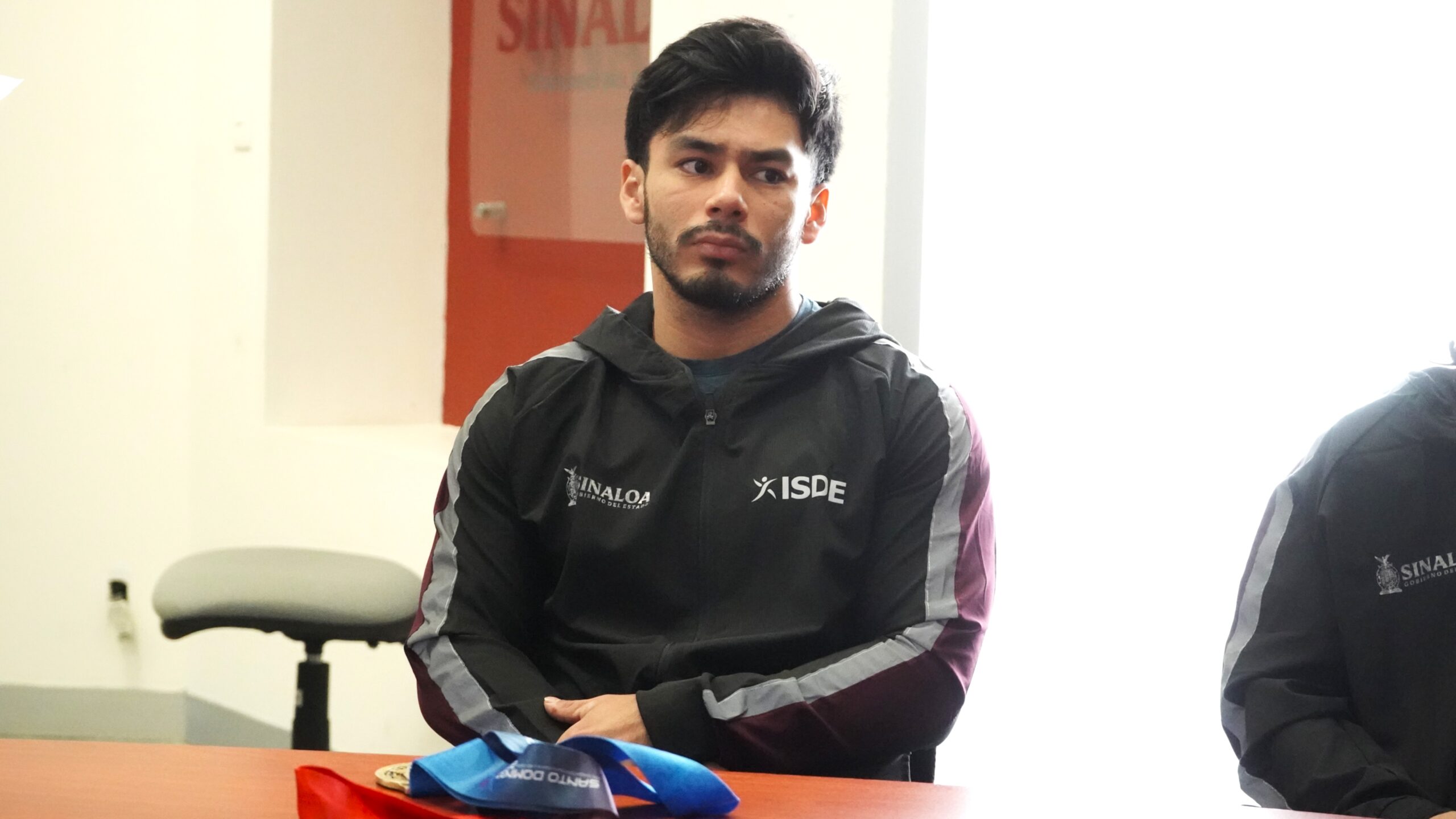 Con la satisfacción de haber conseguido el mejor resultado de su trayectoria en tres participaciones en Juegos Centroamericanos y del Caribe, el halterista sinaloense Jorge Adán Cárdenas Estrada, el popular “Chino”, regresó a Sinaloa con dos medallas en el equipaje y la motivación renovada para continuar su camino rumbo a los Juegos Olímpicos de Los Ángeles 2028.